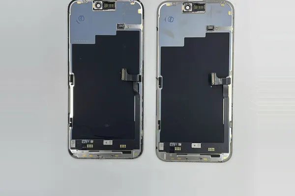 Two replacement iPhone display assemblies, not yet fitted